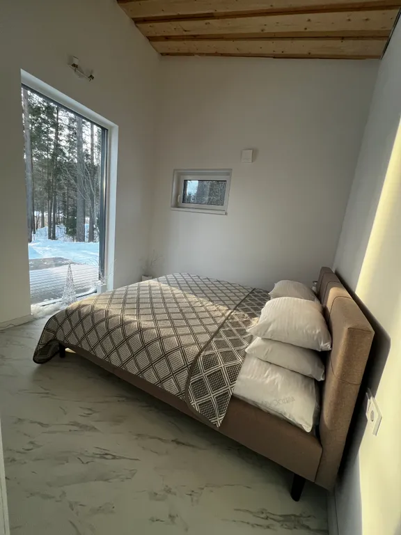 Стильный дом на берегу Ладожского озера с панорамным видом