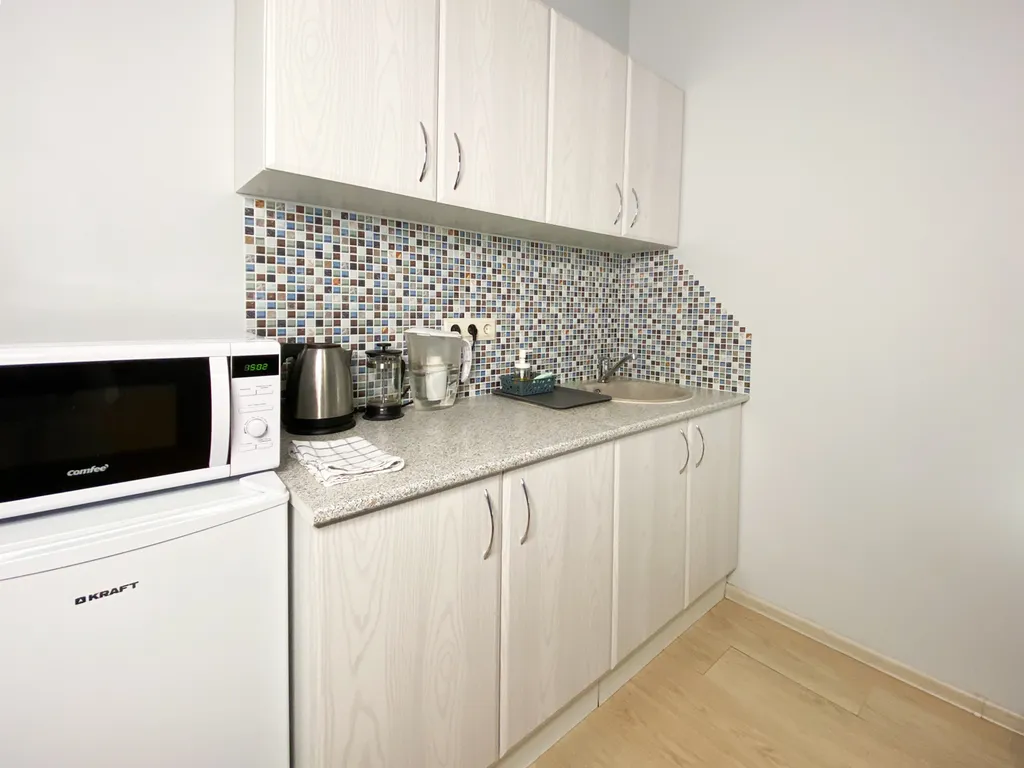 Уютные апартаменты-студио Солнечный Питер на Гончарной улице