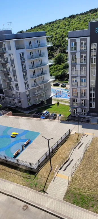 Современная студия у моря с видом на бассейн и горы