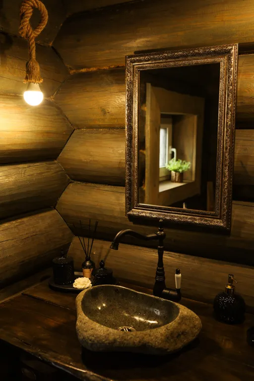 Бревенчатый дом-баня в стиле охотничьего домика