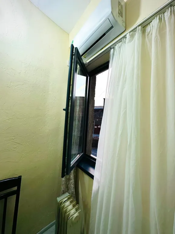 В центре рядом с музеем Сергея Параджанова