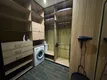 В гардеробной есть фен, стиральная машинка, утюг, сушилка, гель для стирки.