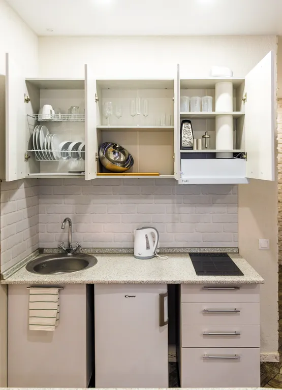 Уютная студия в центре города в стиле лофт с балконом