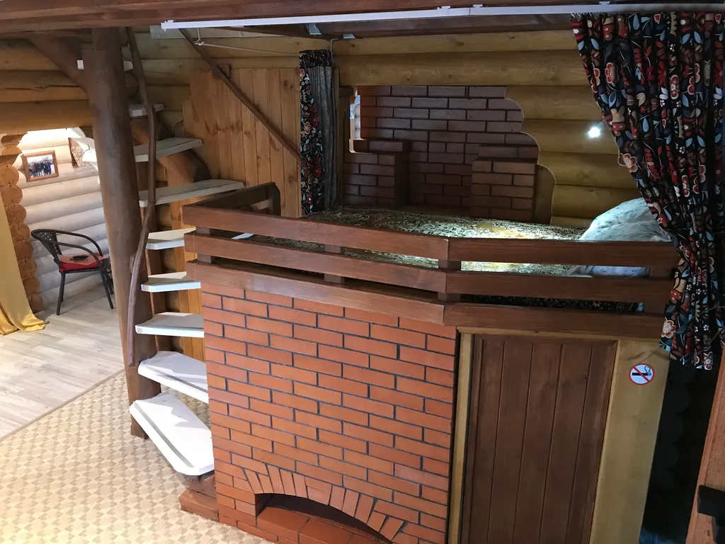 Дом из бревна Терем с сауной в черте города