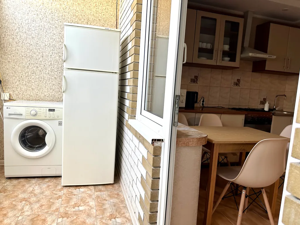 Номер с кухней и ванной комнатой в мини-гостинице со двором