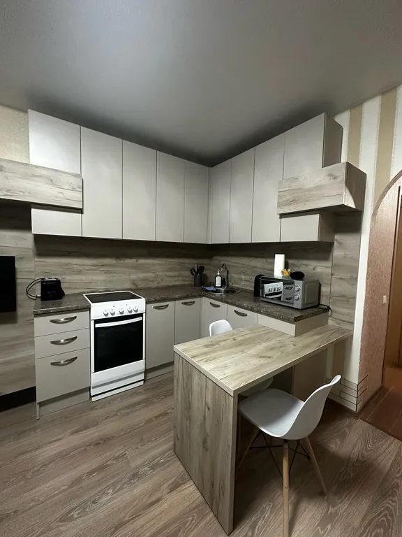 Квартира-студия с новой кроватью и кондиционером