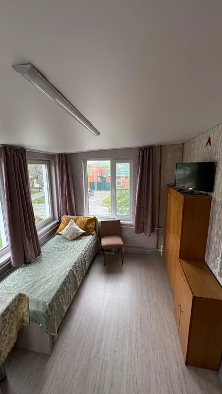 Дом-квартира с мансардой в центре