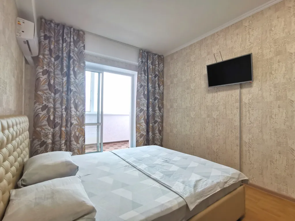 Солнечная квартира с видом на город