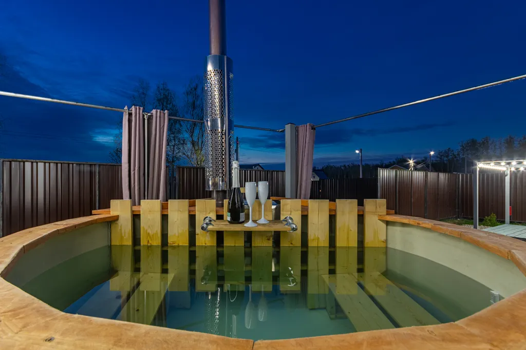 Дом с купелью и сауной, костровой зоной, мангалом и качелями