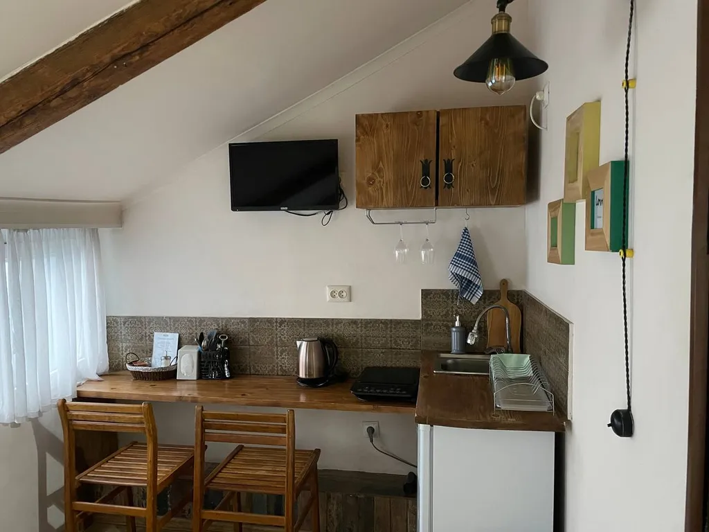 Уютная студия в мансарде грузинского дворика