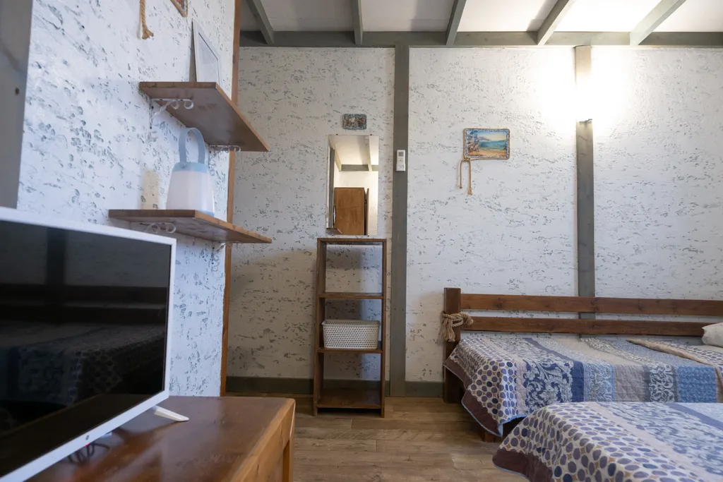 Трёхместный номер с 3 односпальными кроватями