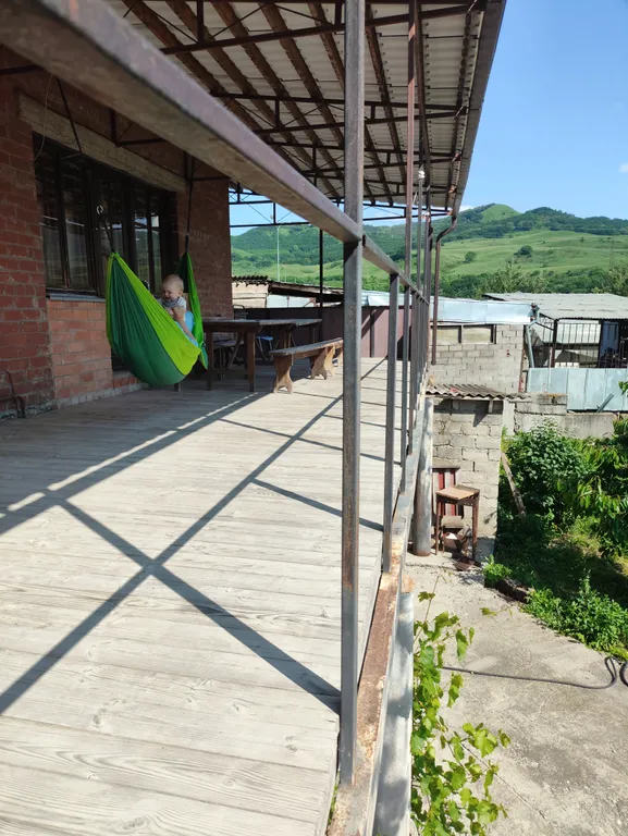 Дом с балконом