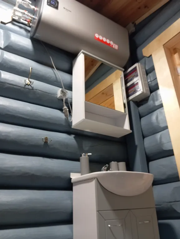 Меличуярви дом из бревна с сауной на берегу озера у самого леса