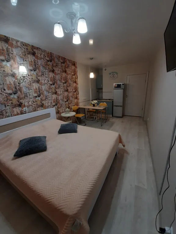 Уютная студия в новом доме с панорамным видом на город