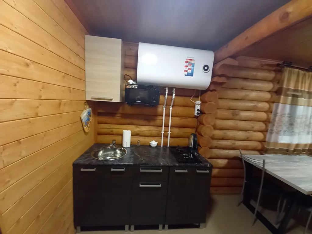 Домик из сосны в городе  С.