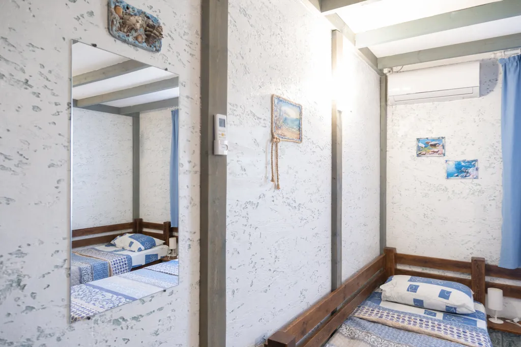 Трёхместный номер с 3 односпальными кроватями