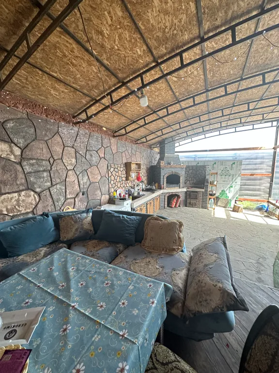 Дом из бруса на берегу моря с зоной барбекю и собственной парной