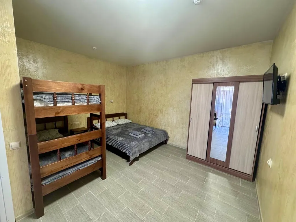 Семейный номер с кухней на веранде в центре