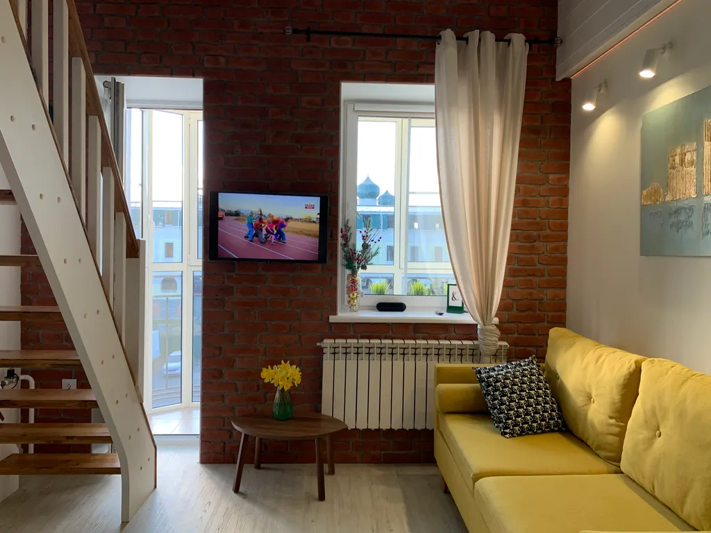 Двухуровневые апартаменты Снегурочка на набережной в центре города