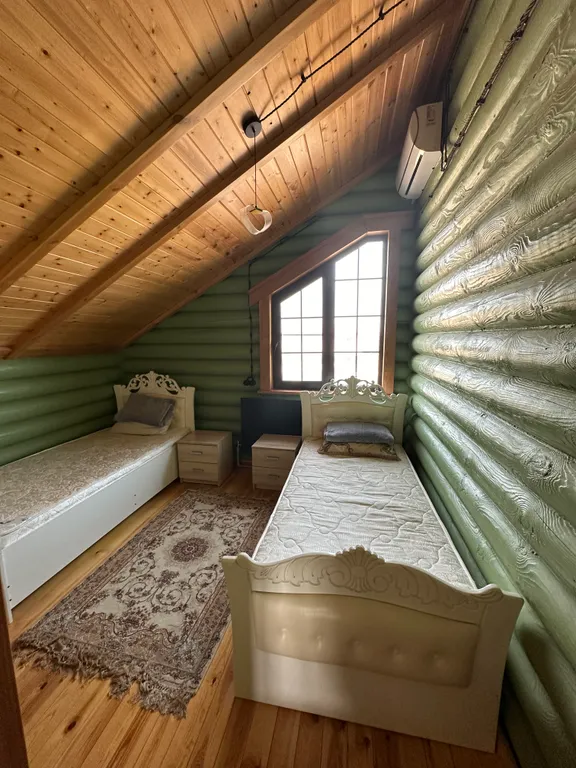 Дом из бруса на берегу моря с зоной барбекю и собственной парной