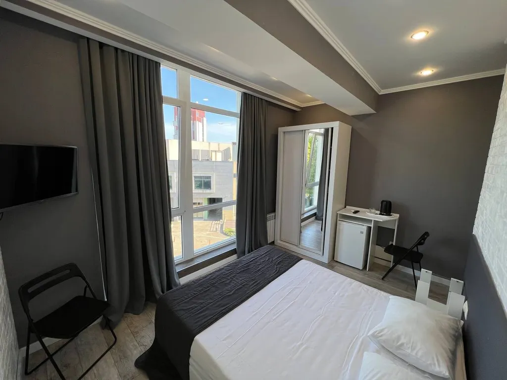 Двухместный номер с 2 кроватями или 1 двуспальной и панорамным окном