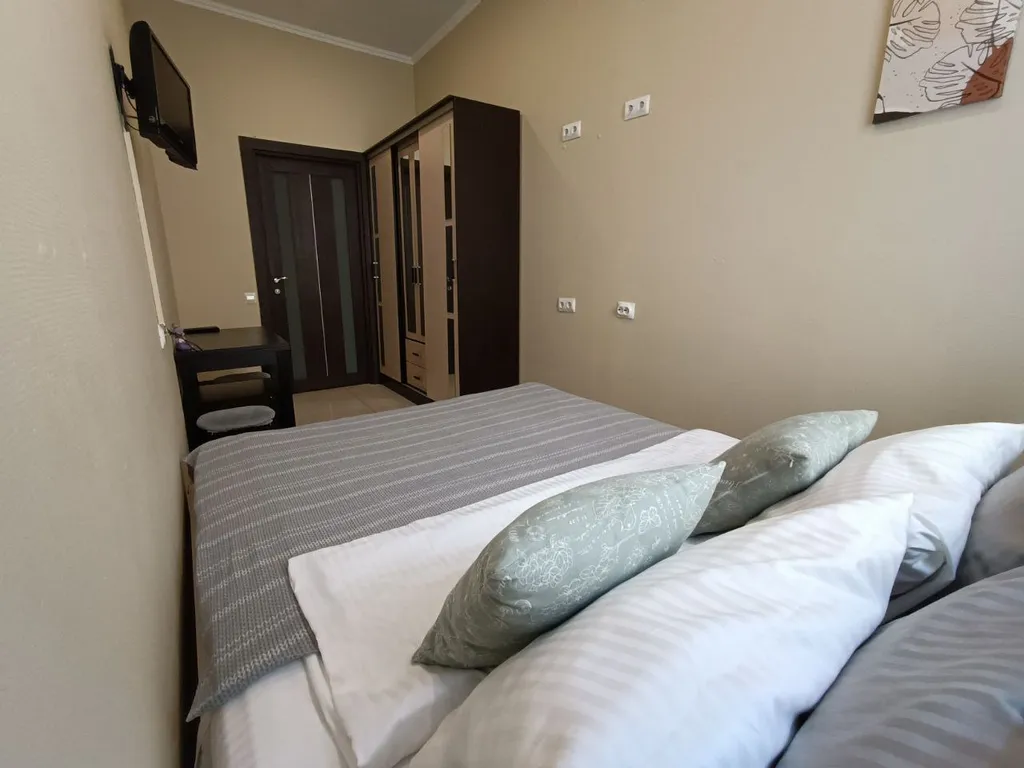 Комнаты с двуспальной кроватью, общими санузлами и кухней