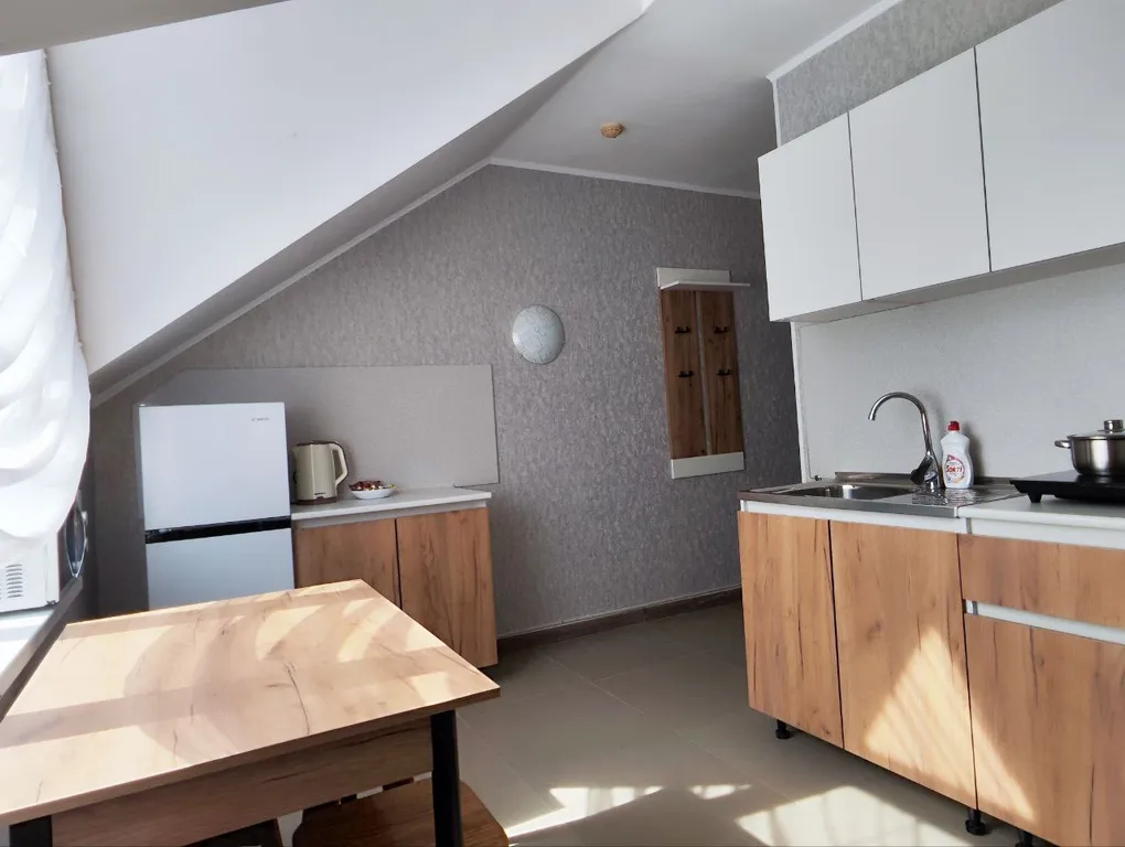 Апартаменты с 1 спальней на мансардном этаже гостевого дома Регион 86