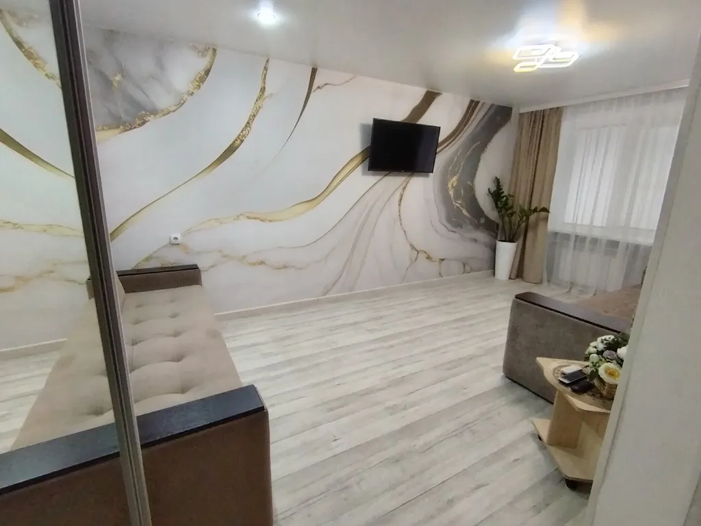 Квартира в центре на первом этаже с асфальтированной парковкой