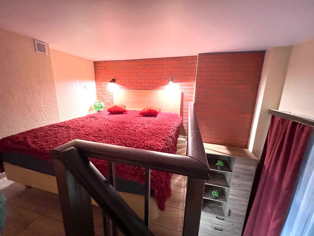 Стильная двухуровневая студия Лофт