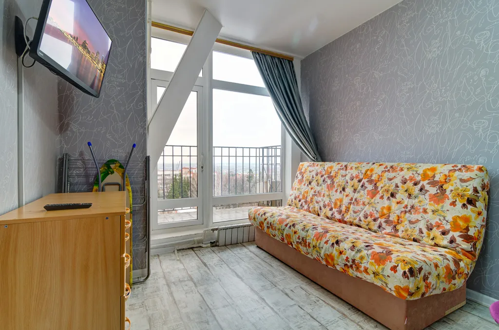 Апартаменты с панорамным окном и видом на город в Центре