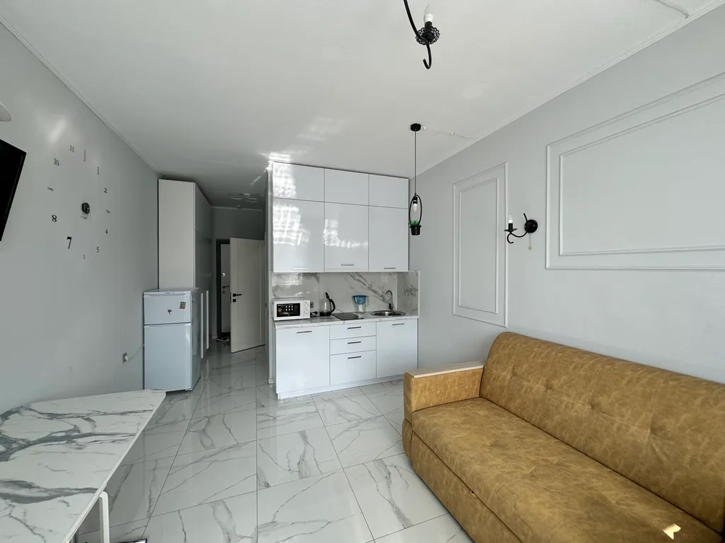 Светлая студия с удобным расположением