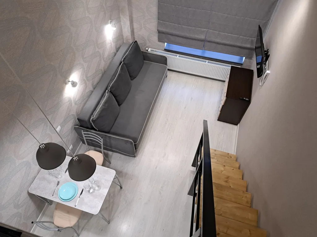 Стильная и уютная двухъярусная студия