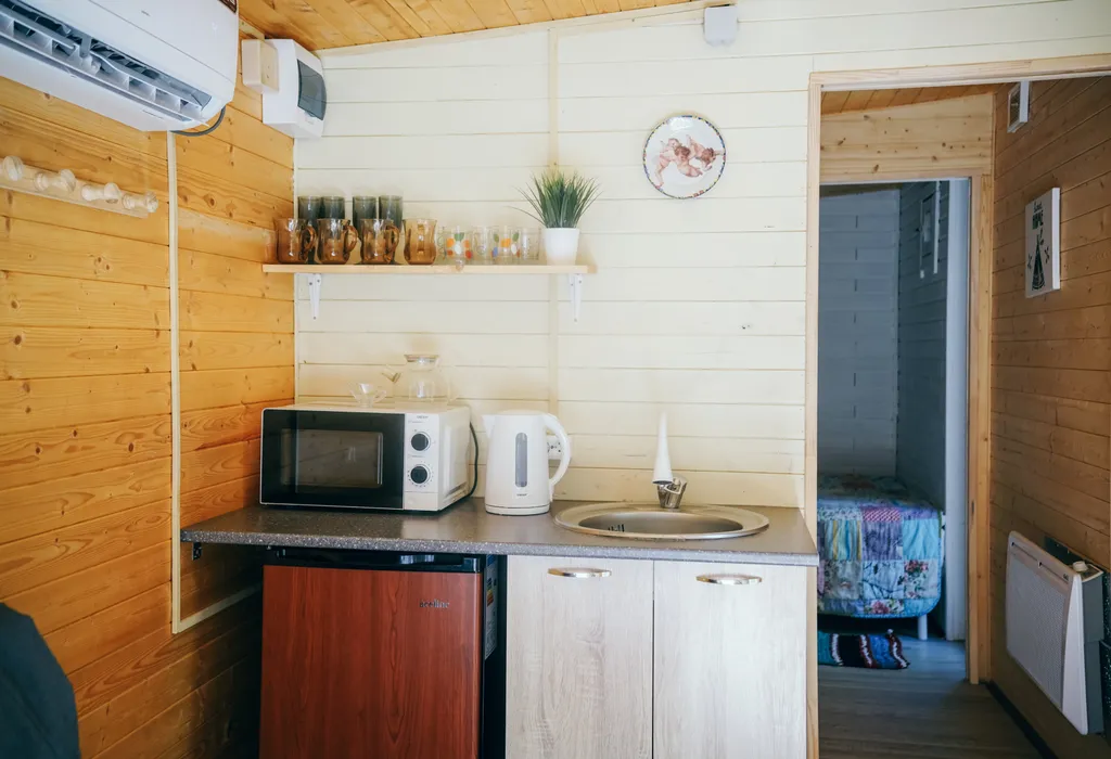 Уютный домик в лесу с террасой и беседкой