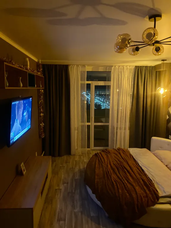 Пентхаус с видом на город. Круглая кровать+ диван