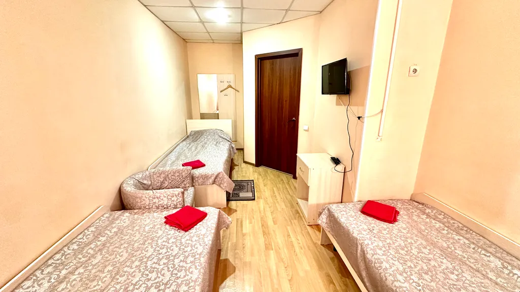 Номер с тремя односпальными кроватями