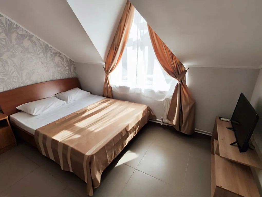 Апартаменты с 1 спальней на мансардном этаже гостевого дома Регион 86