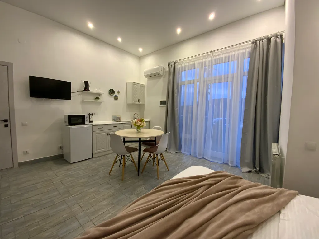 Семейная студия с террасой видом на горы и море