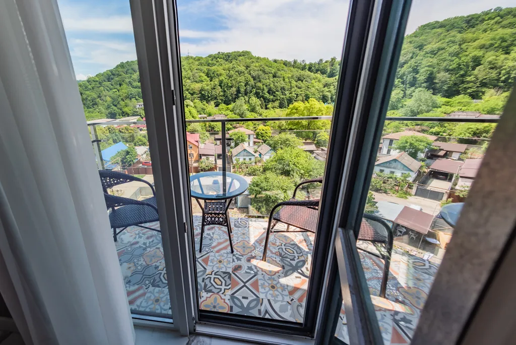 Студия Real Apartments Sochi с бассейном и видом на горы