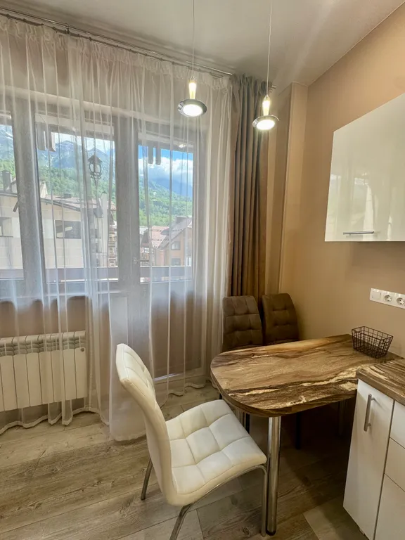 Светлая уютная студия с видом на горы