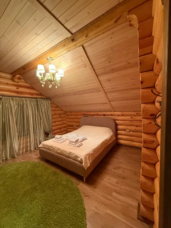 Двухэтажный дом из сруба а Теберде с баней с видом на горы и реку