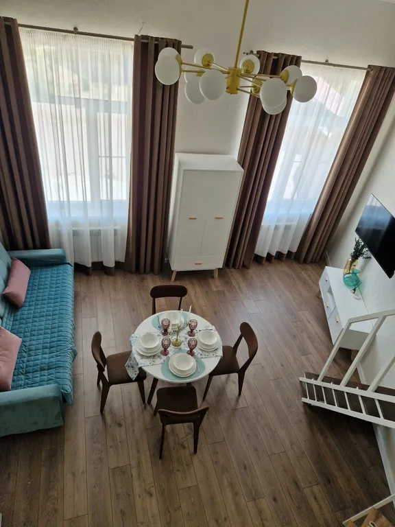 Уютная двухуровневая студия в центре