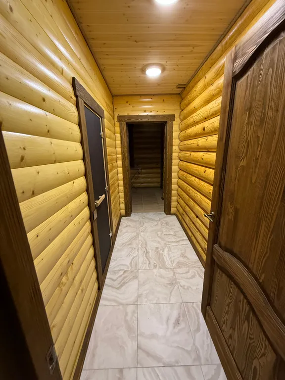 Двухэтажный дом из сруба а Теберде с баней с видом на горы и реку