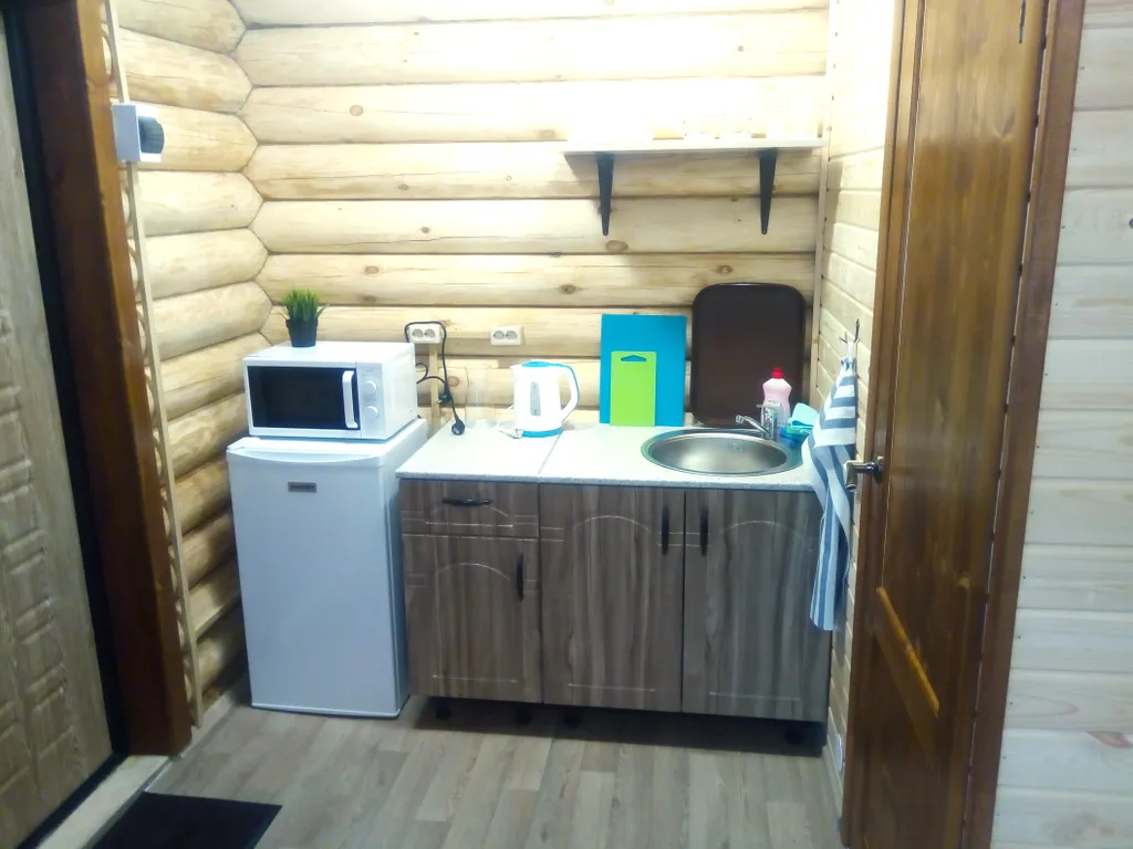 Уютная студия в доме из бревна