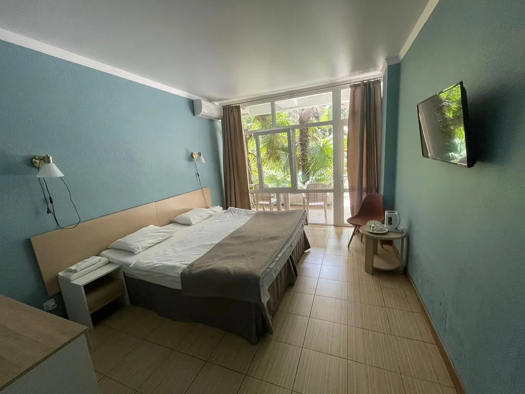 Квартира Квартира Уютный номер на 1 этаже с видом на парк с балконом. — Гагра