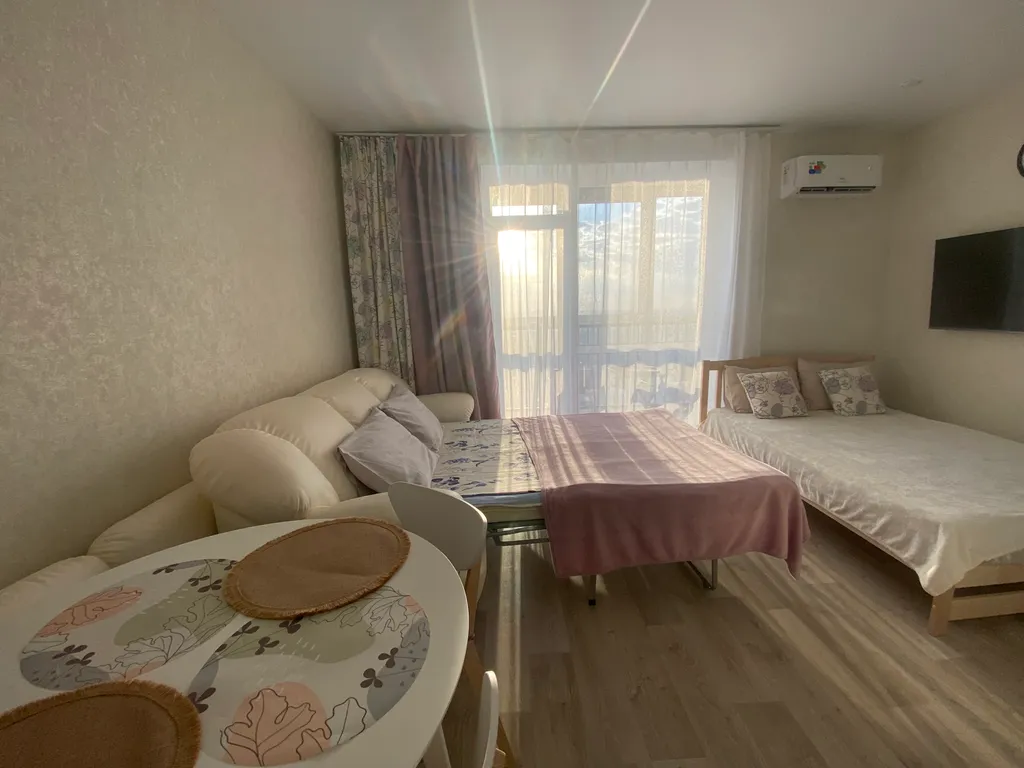 Уютная студия с видом на город