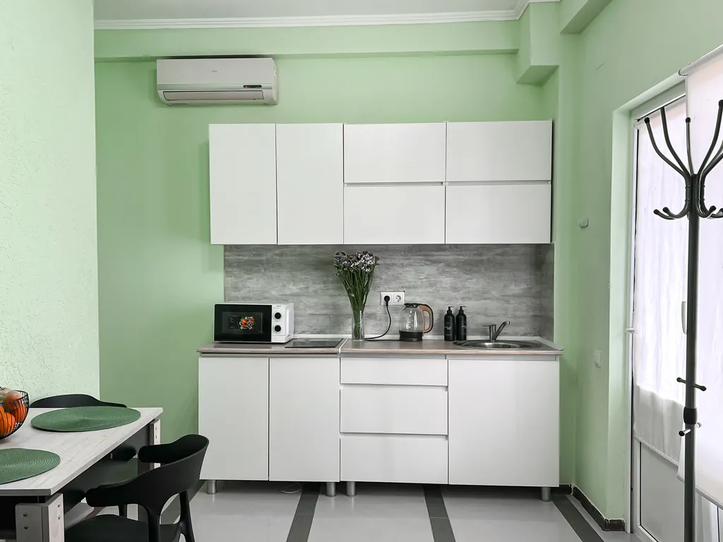 Семейный номер с кухней в центре