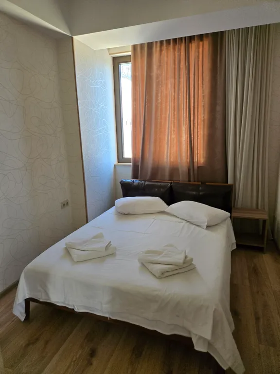 Апартамент с балконом с видом на город