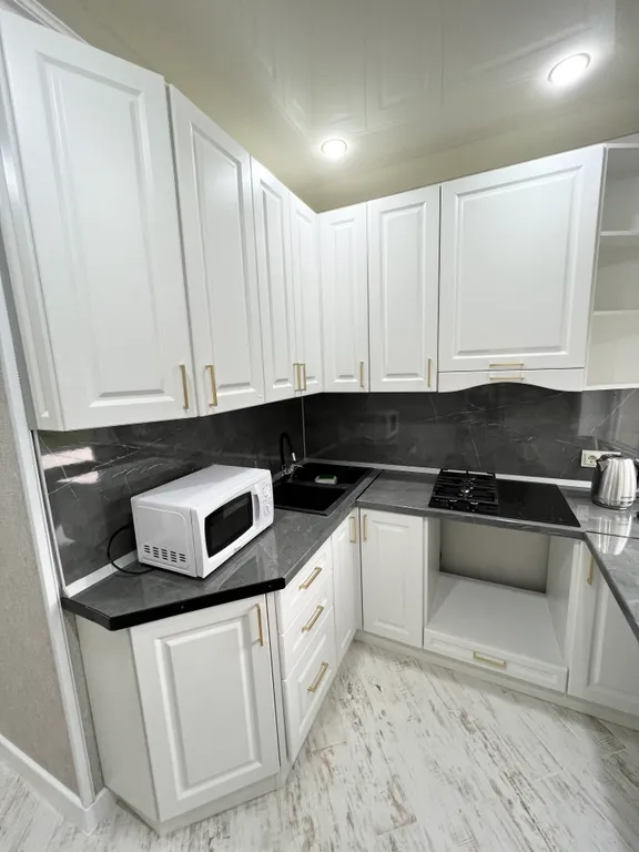 Апартамент с видом на море и на колесо обозрения