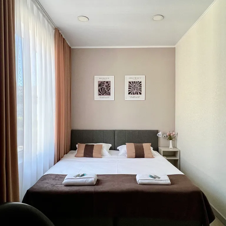 Квартира Квартира Уютный номер с 1 двуспальной или 2 раздельными кроватями — Сириус