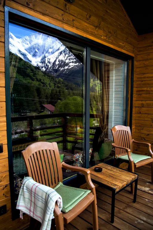 Уютная студия люкс с панорамными окнами с видом на горы